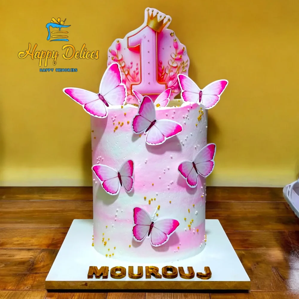 Handmade first birthday cake decorated with pink butterflies in Agadir – Happy Delices