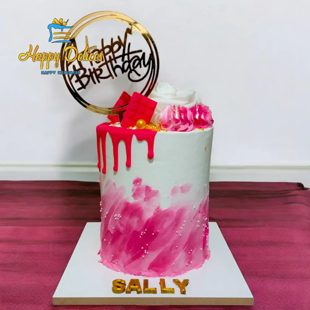 Pink and white drip birthday cake with golden accents and modern design