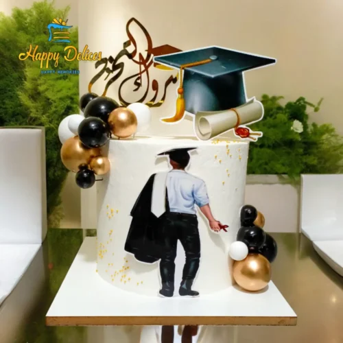Graduation cake for him with black and gold accents, cap, and scroll decoration