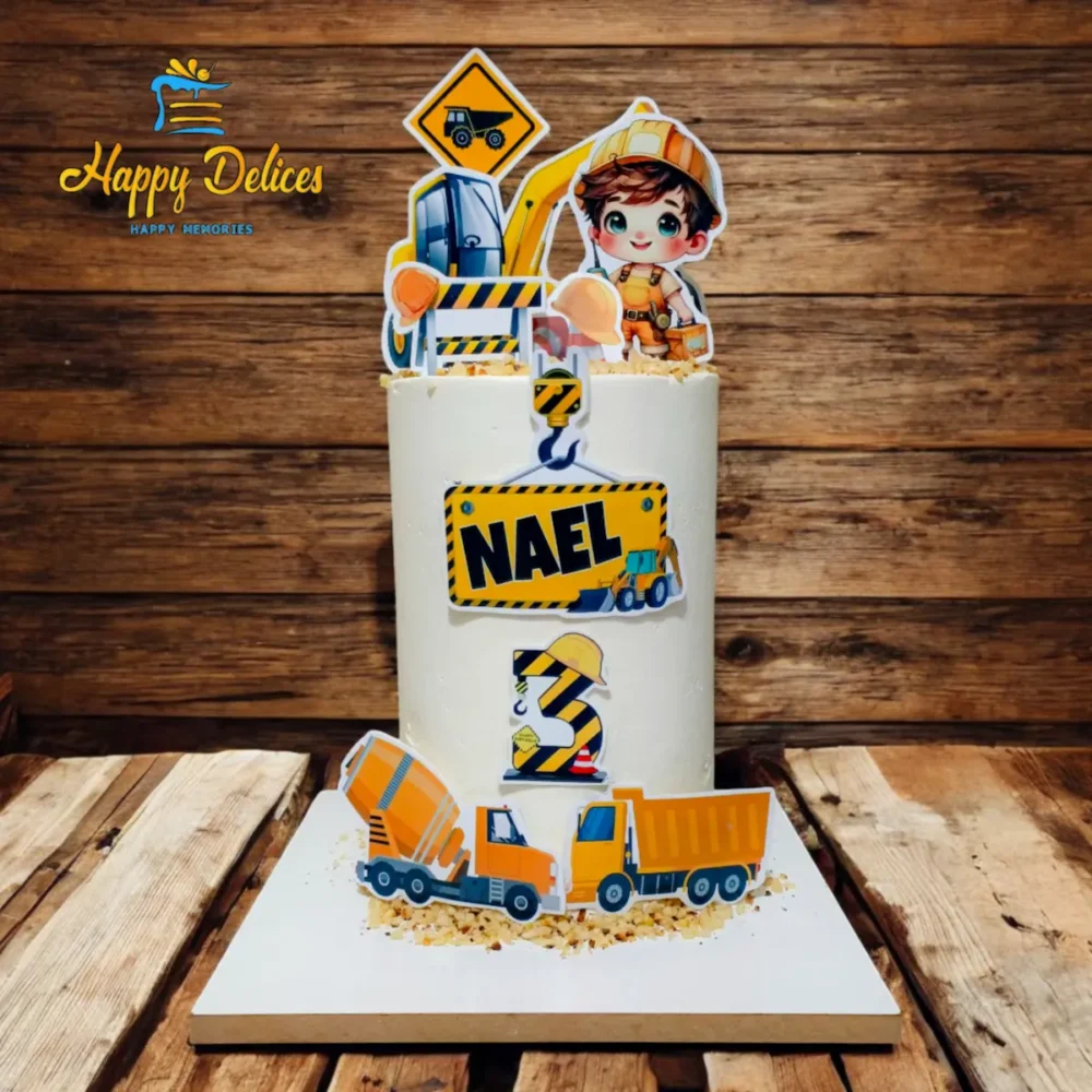 Construction Theme Birthday Cake for Kids | Happy Delices Kids construction theme birthday cake with trucks, helmets, and cute builder topper