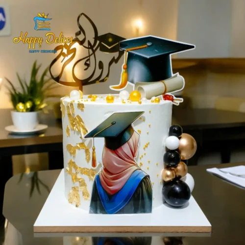 Elegant graduation cake with golden accents, academic cap, and scroll decoration