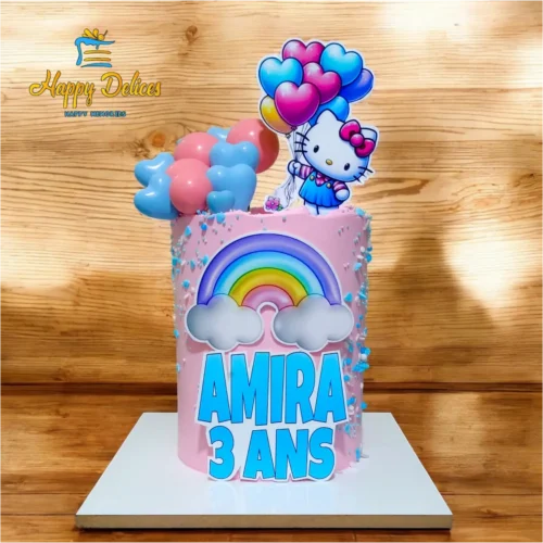 Pink Hello Kitty birthday cake with rainbow and balloon decorations by Happy Delices