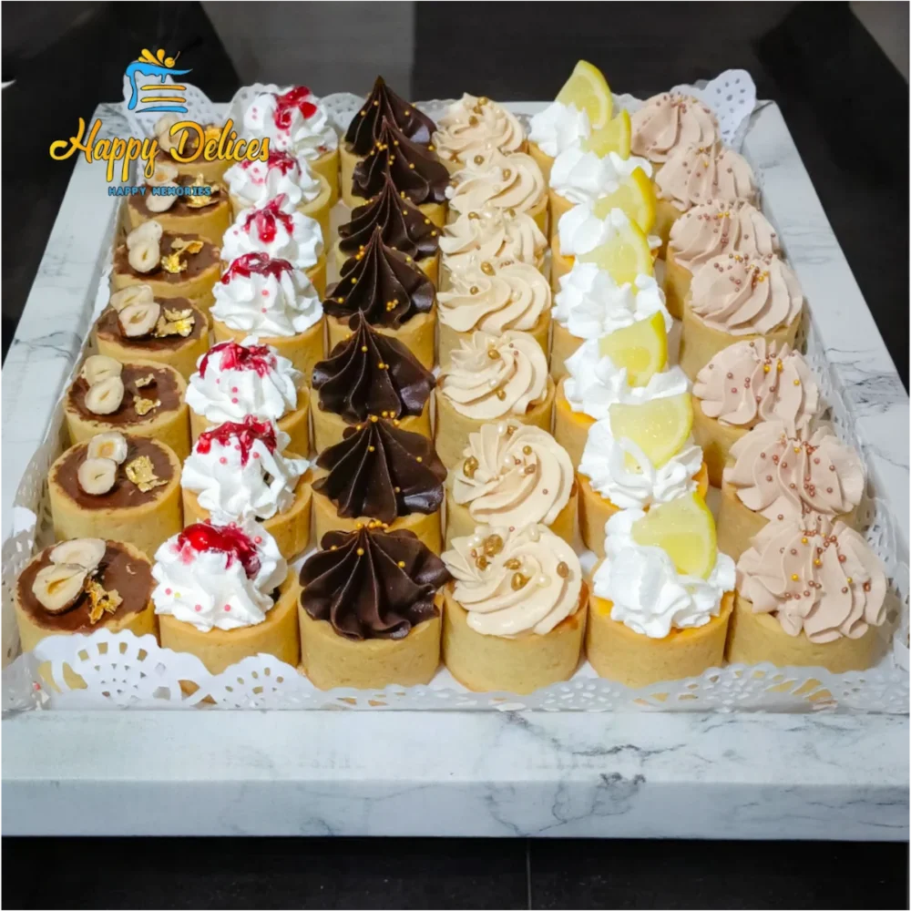 Assorted Mini Tartelettes | Happy Délices Assorted mini tartelettes with chocolate, hazelnut, raspberry, lemon, caramel, and almond praline flavors