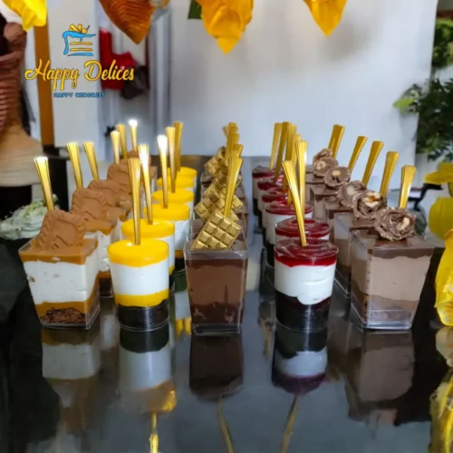 Assorted verrines dessert cups with chocolate, lotus, lemon, and berry flavors