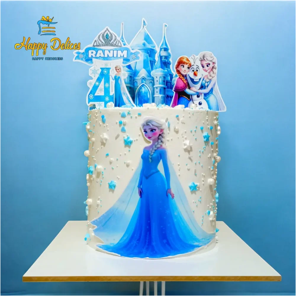 Frozen themed birthday cake with Elsa, Anna, and Olaf decorations by Happy Delices