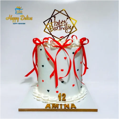 White cake with red ribbons and small heart decorations by Happy Delices