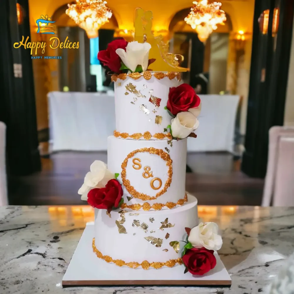 Wedding Cake Red & White with Golden Accents | Happy Delices Elegant three-tier wedding cake with red and white roses and golden decorations