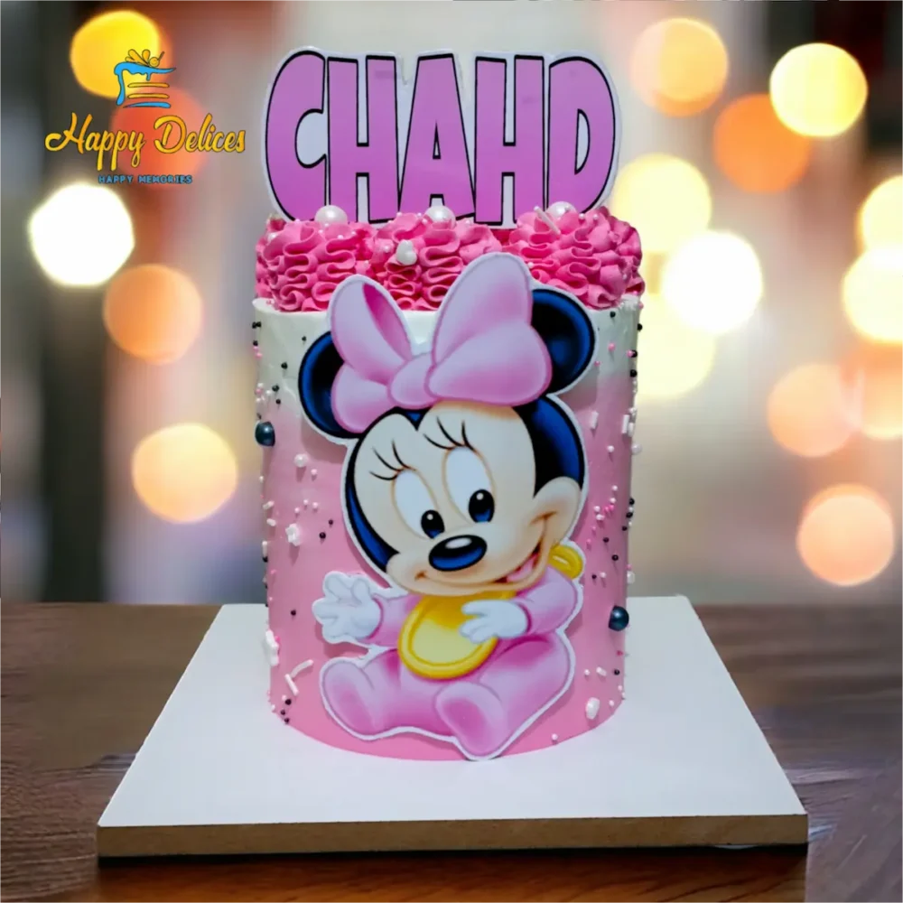 Pink Baby Minnie Birthday Cake | Happy Delices Pink baby Minnie birthday cake with decorative pearls and a name topper by Happy Delices
