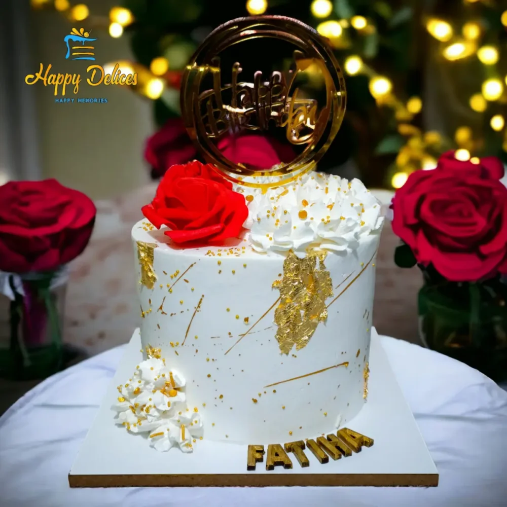 Elegant White and Gold Birthday Cake | Happy Delices Elegant white and gold birthday cake with red roses and personalized name topper by Happy Delices