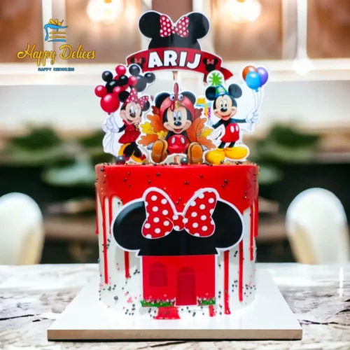 Minnie Mouse red and white birthday cake with personalized name topper by Happy Delices