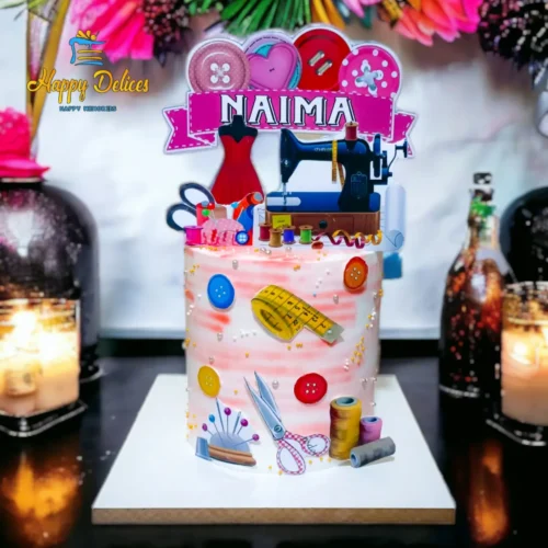Sewing themed birthday cake with tailoring elements and personalized name topper by Happy Delices