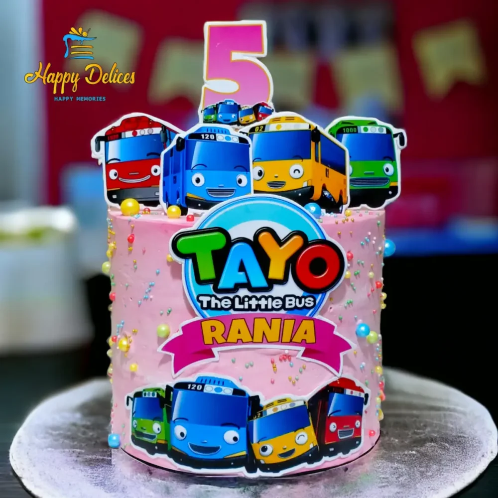 Tayo The Little Bus Themed Birthday Cake | Happy Delices Tayo The Little Bus themed pink birthday cake with colorful bus characters and name topper by Happy Delices