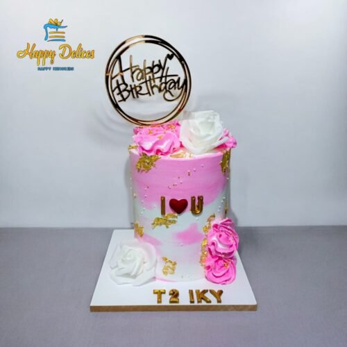 Pink and white ombre birthday cake with gold accents, roses, and Happy Birthday topper by Happy Delices