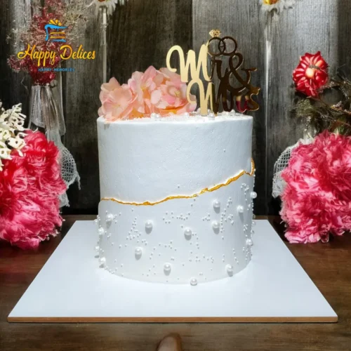 Elegant white engagement cake with gold line detail and Mr and Mrs topper by Happy Delices