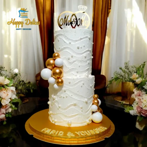 Luxury white engagement cake with wave texture and gold balloon details by Happy Delices