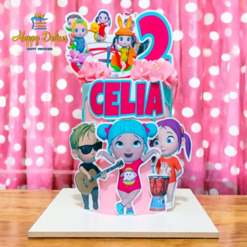 Pink and blue CoComelon themed birthday cake for Celia's 2nd birthday, featuring colorful cartoon characters, pink frosting and a personalized name topper by Happy Delices Agadir.